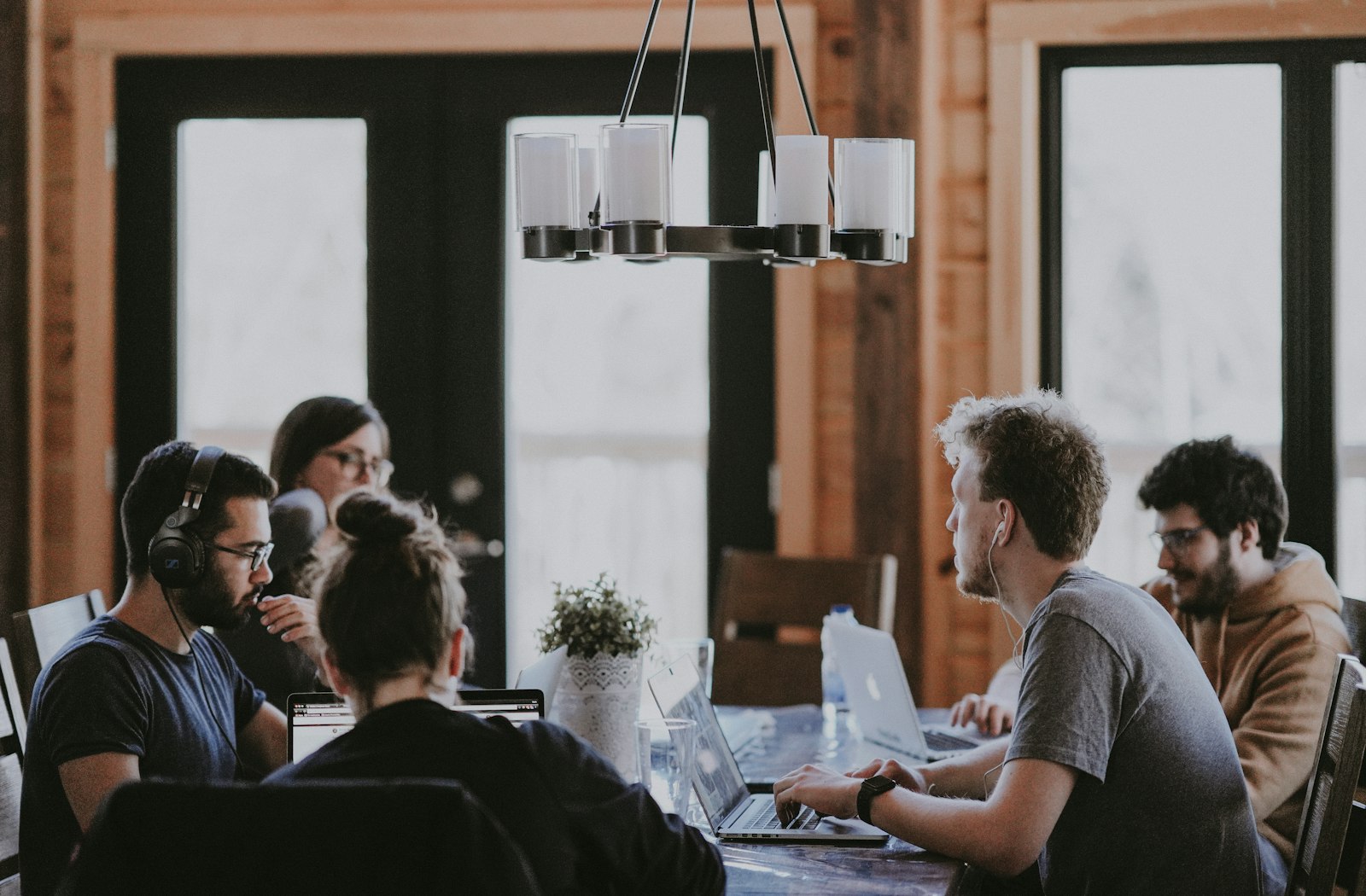 Team members working together at a shared table
